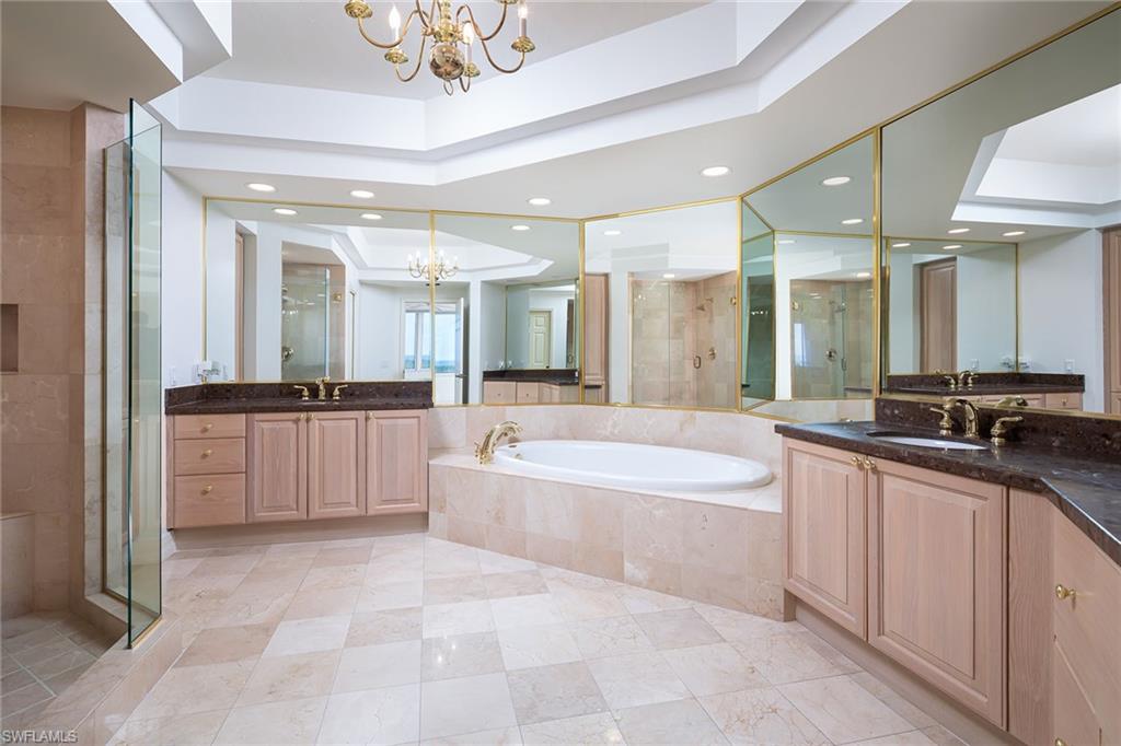 435 Dockside Drive, Unit B703 Naples, FL 34110 - Photo 19 of 38 a large spacious bathroom with a large tub shower and sink