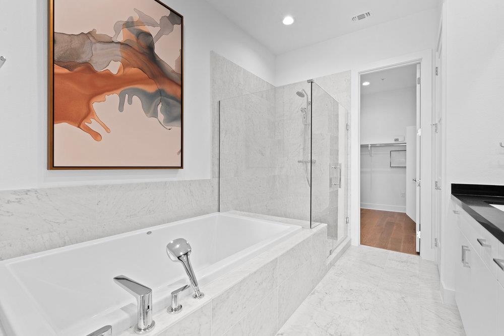 2805 McCurdy Street, Unit 4 Austin, TX 78723 - Photo 19 of 40 a bathroom with a tub and shower