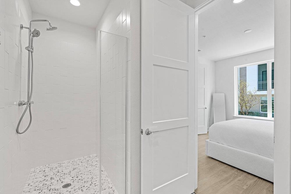 2805 McCurdy Street, Unit 4 Austin, TX 78723 - Photo 23 of 40 a bedroom with a bed and a window