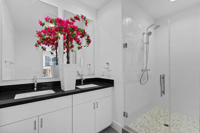 a bed room with a bed and a painting on the wall