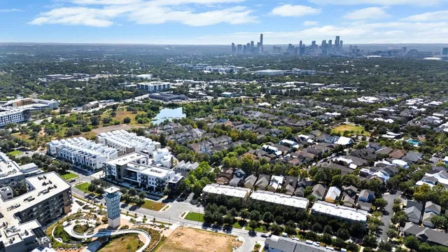 a view of a brick building next to a yard