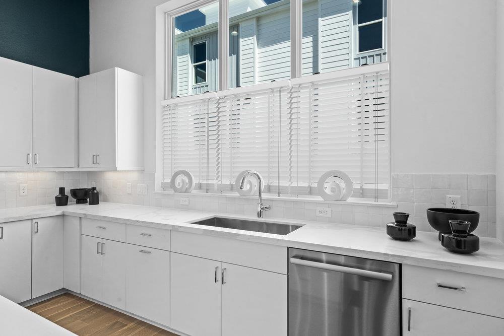 2805 McCurdy Street, Unit 4 Austin, TX 78723 - Photo 10 of 40 a kitchen with a sink and cabinets