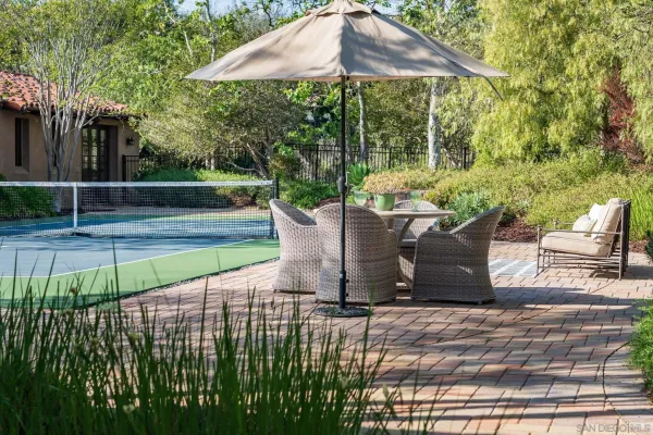 a view of a backyard with sitting area