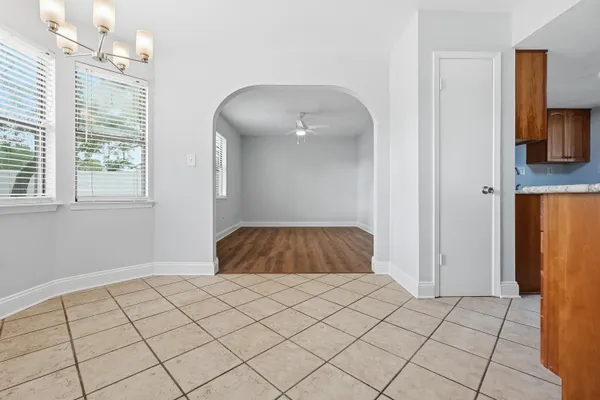 a kitchen with stainless steel appliances granite countertop a refrigerator a oven and a sink