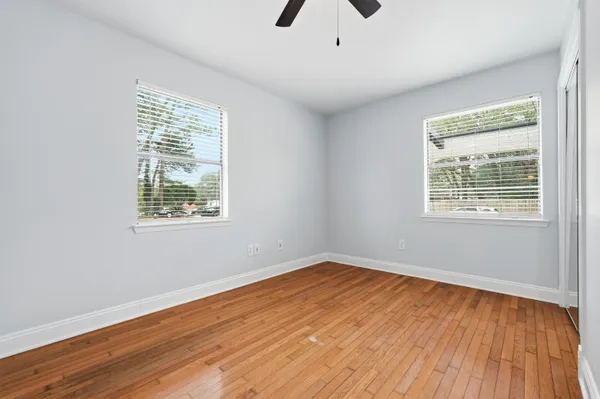 a view of entryway and hall with wooden floor
