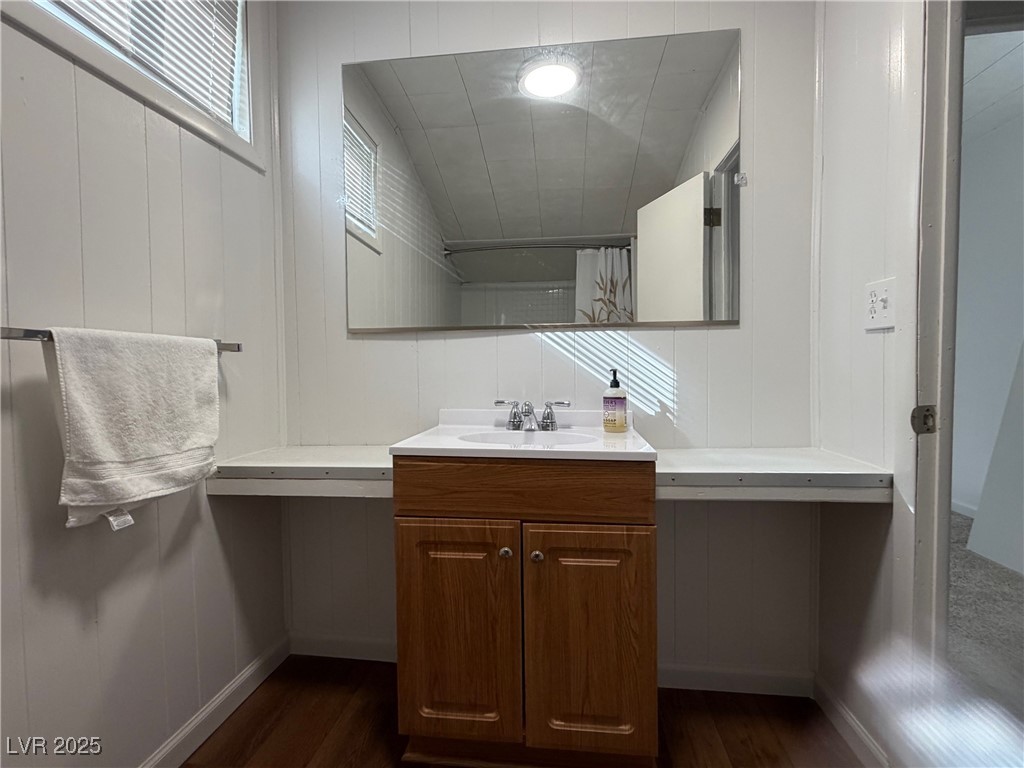1144 Ave D Ely, NV 89301 - Photo 13 of 15 Bathroom featuring vanity and dark wood-style flooring