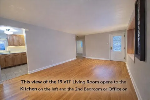 a view of an empty room and a window