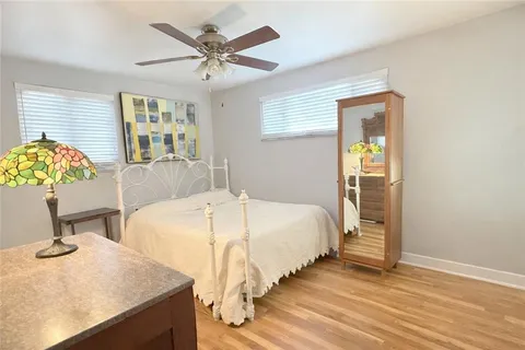 a bedroom with a bed and a table