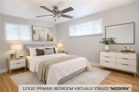 a bedroom with a bed and a dresser