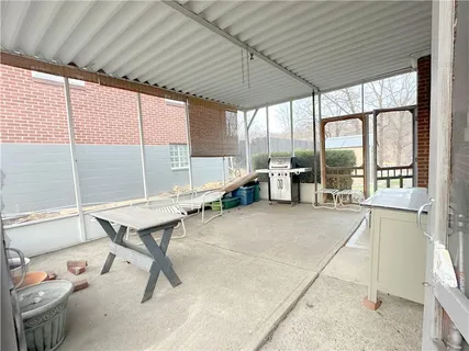 a room with window and furniture