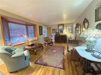 a living room with furniture fireplace and a table