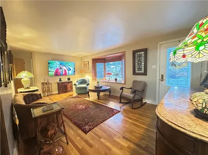 a living room with furniture window and a potted plant