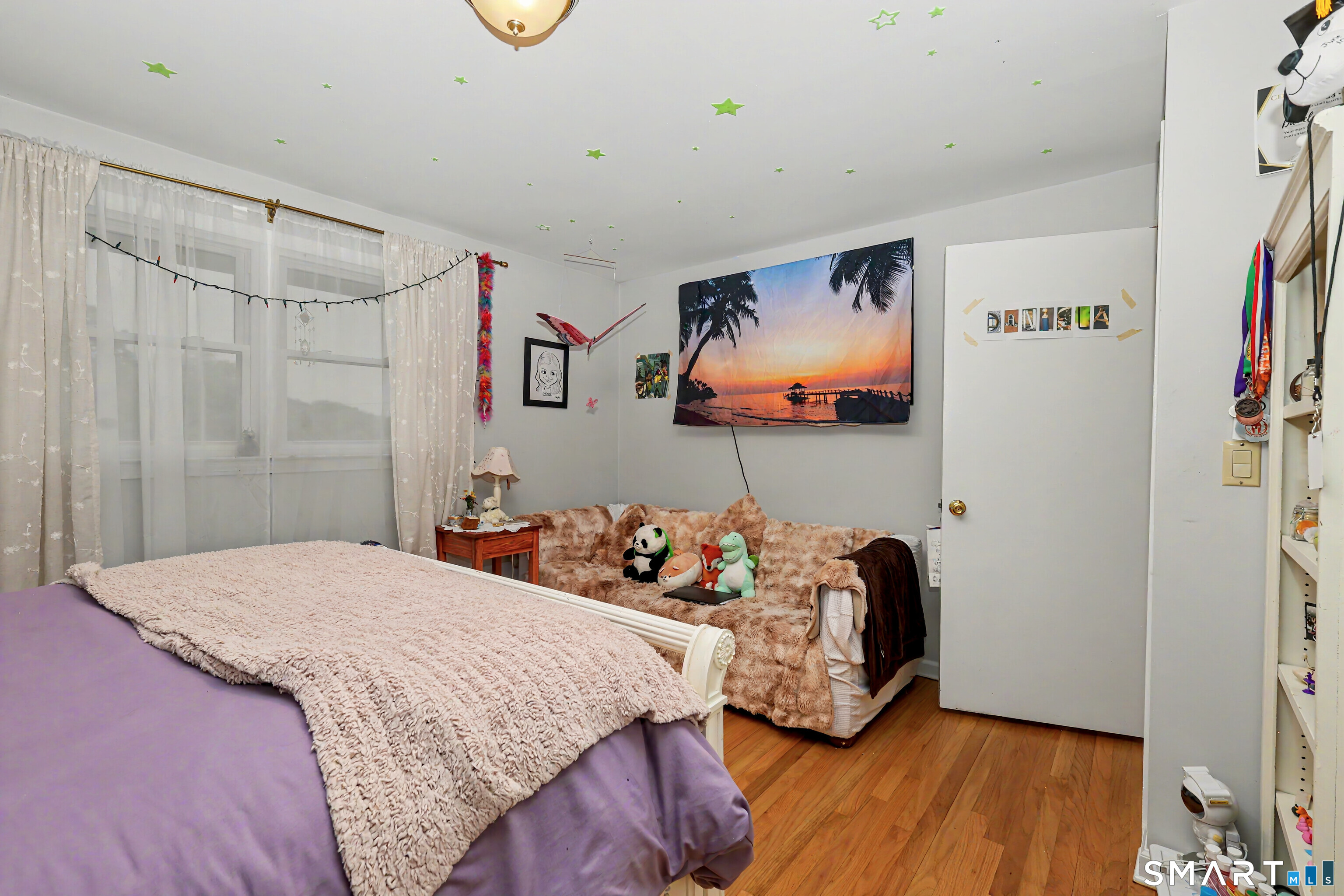 44 Haverhill Road Trumbull, CT 06611 - Photo 18 of 32 a bedroom with bed and wooden floor