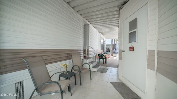 a living room with a couch and a window