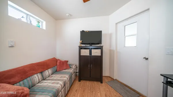 a view of a chairs and table in the balcony