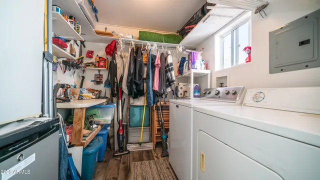 a view of a house with a yard table and chairs