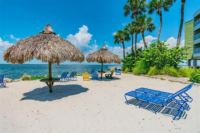 a view of a patio with a table and chairs