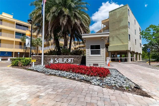a view of multiple houses with palm trees