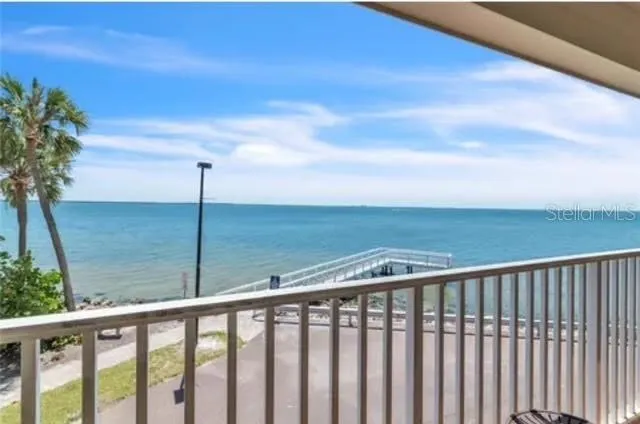 a view of roof deck with mountain view