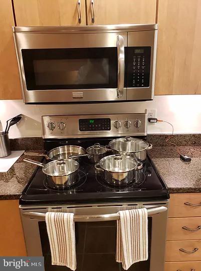 a close view of stove and microwave