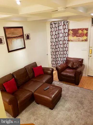 1018 Booth Street Baltimore, MD 21223 - Photo 4 of 6 a living room with furniture and a couch
