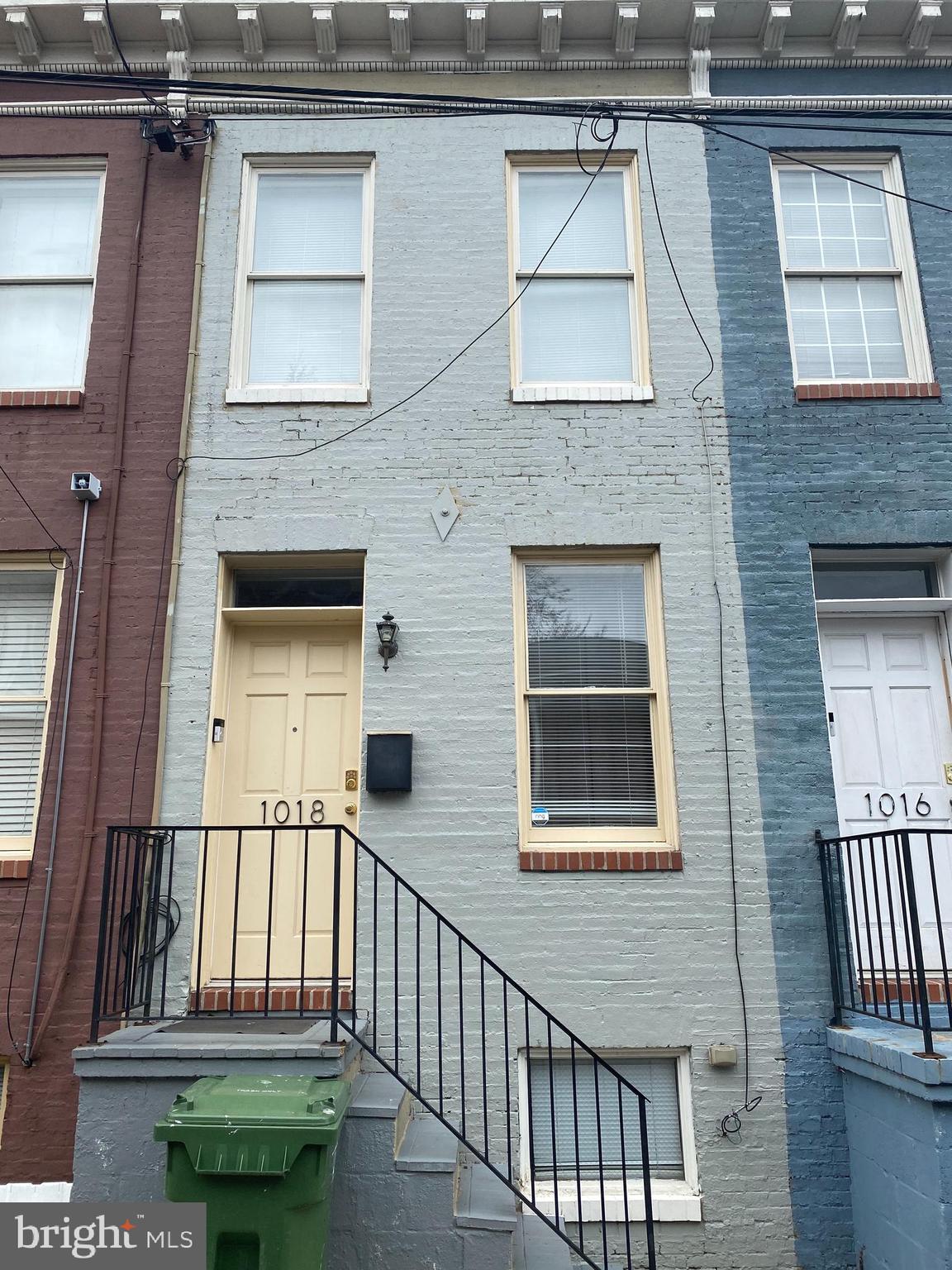 1018 Booth Street Baltimore, MD 21223 - Photo 6 of 6 a view of a brick house with a large windows