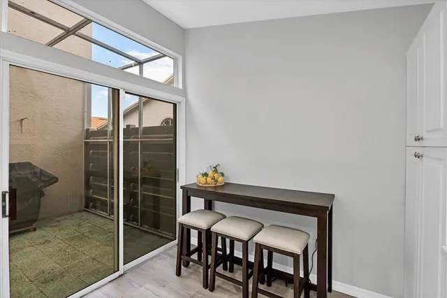 a dining room with furniture and window
