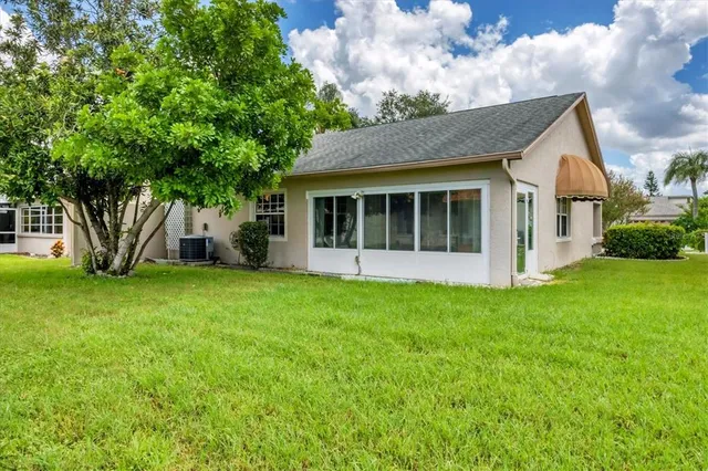 a view of an house with backyard space and garden