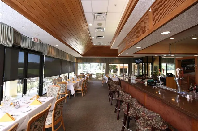 a view of swimming pool with outdoor seating