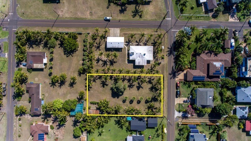 8589 Elepaio Road Kekaha, HI 96752 - Photo 2 of 16 an aerial view of a houses with yard