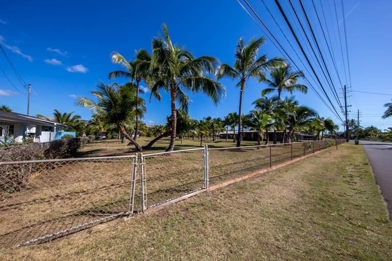 8589 Elepaio Road Kekaha, HI 96752 - Photo 5 of 16 a view of a street with a building in the background