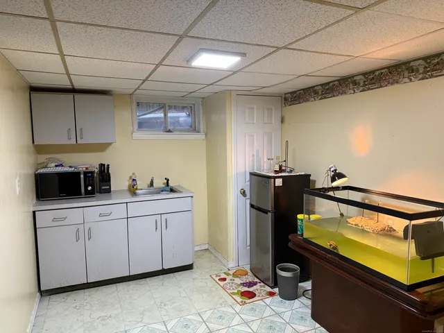 a kitchen with a sink and cabinets