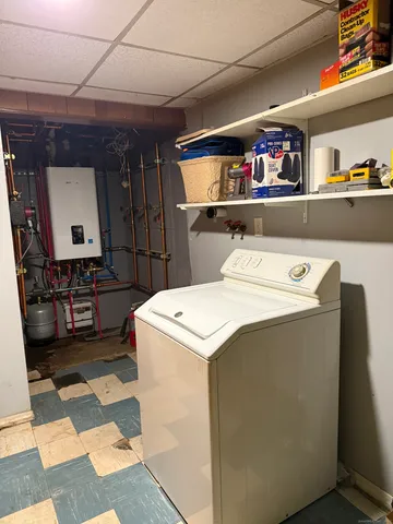 a bathroom with a toilet a sink and a mirror