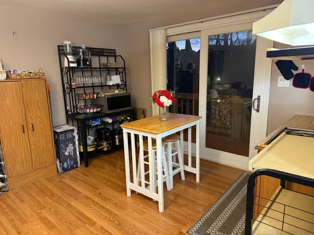 a kitchen with stainless steel appliances granite countertop a stove top oven a sink and cabinets