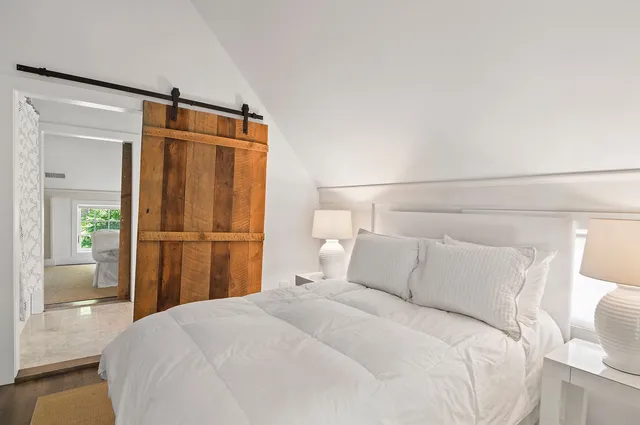 a bedroom with a bed and closet