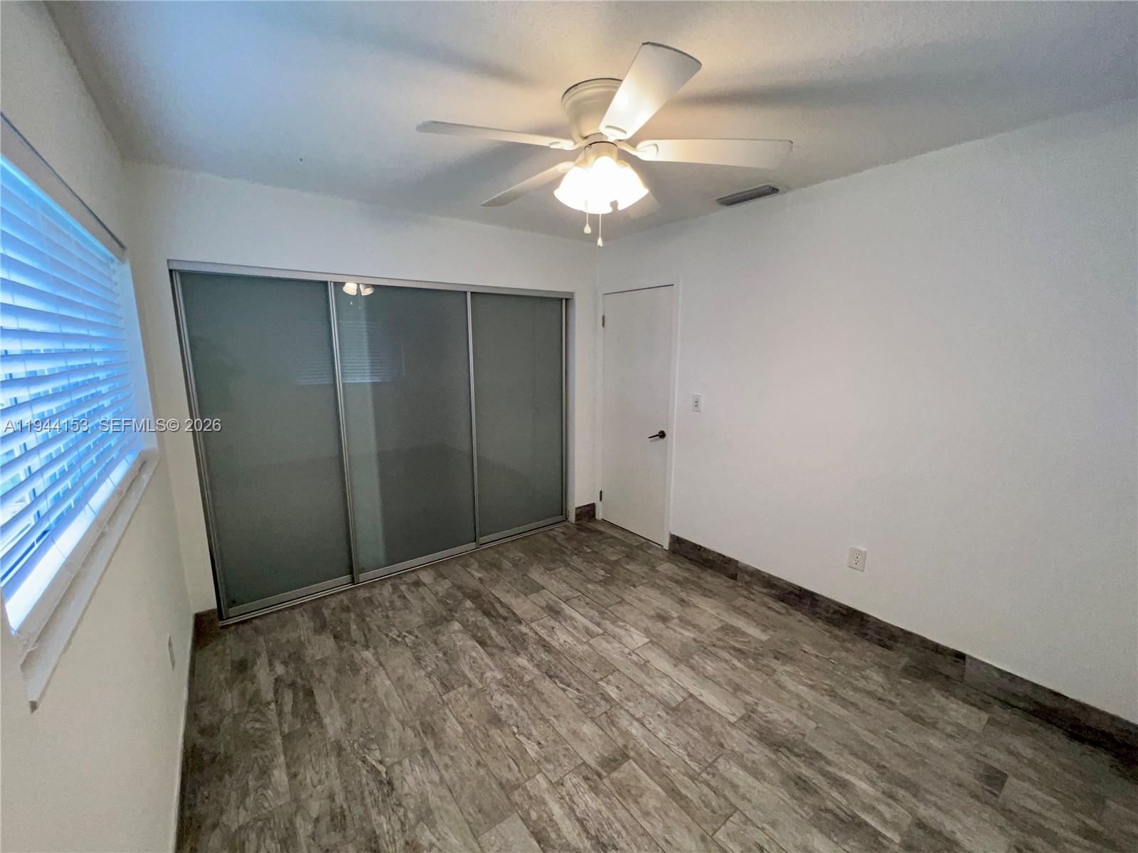 1881 Northeast 210th Street Miami, FL 33179 - Photo 15 of 29 a view of a livingroom with a fan