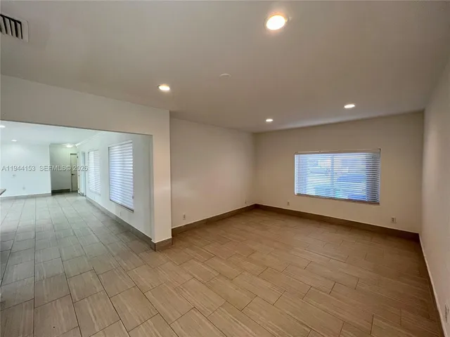 a view of a kitchen from the hallway