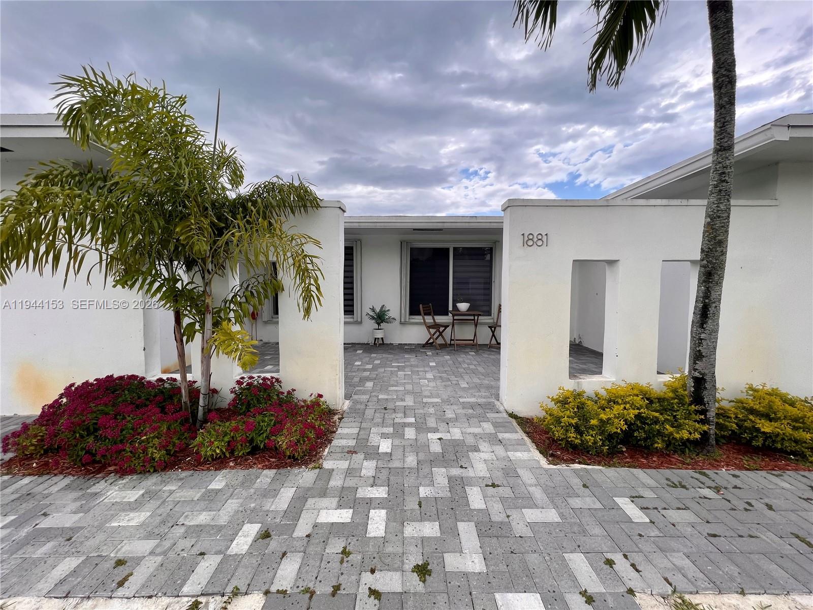 1881 Northeast 210th Street Miami, FL 33179 - Photo 4 of 29 a view of a entryway front of house