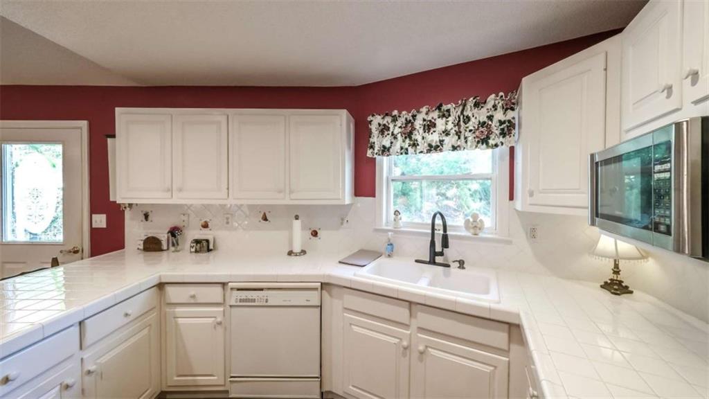 396 Pam Street Wedowee, AL 36278 - Photo 11 of 48 a kitchen with a sink cabinets and window