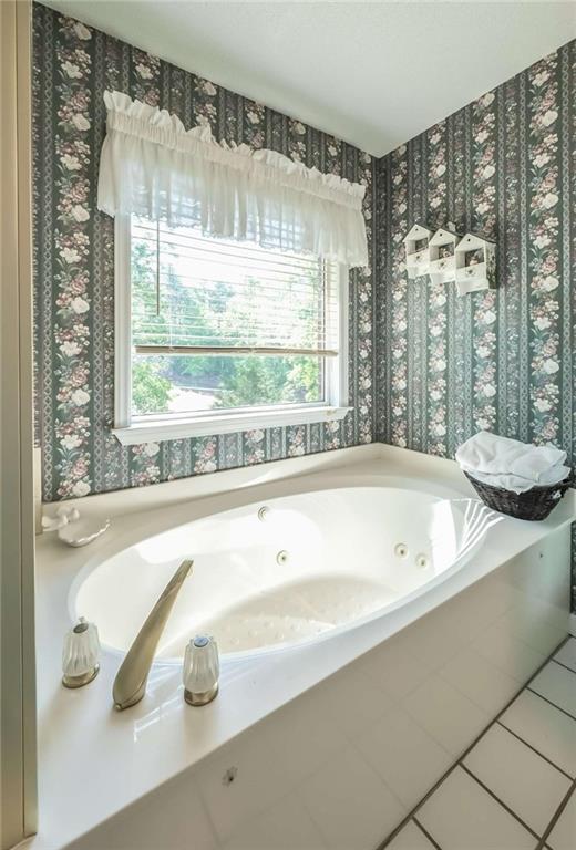 396 Pam Street Wedowee, AL 36278 - Photo 20 of 48 a bathroom with a bathtub and a large window