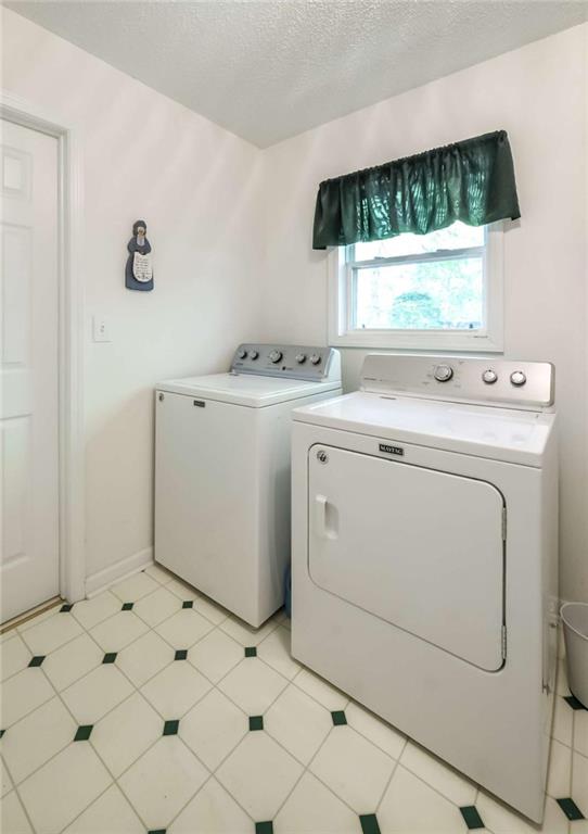 396 Pam Street Wedowee, AL 36278 - Photo 26 of 48 a utility room with dryer and washer