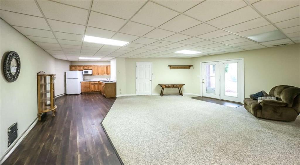 396 Pam Street Wedowee, AL 36278 - Photo 32 of 48 a spacious bedroom with a bed and wooden floor