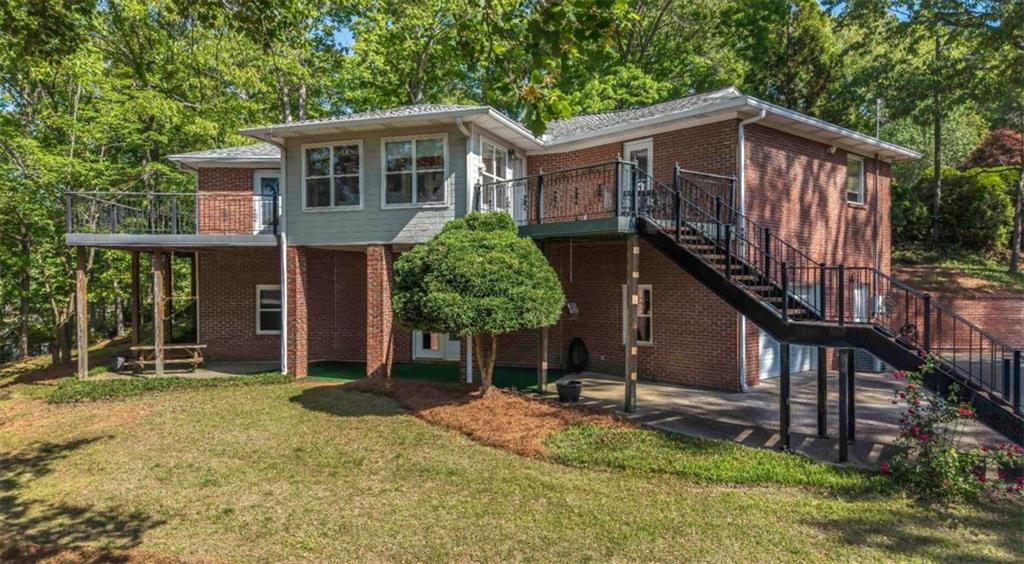 396 Pam Street Wedowee, AL 36278 - Photo 5 of 48 a front view of a house with a yard