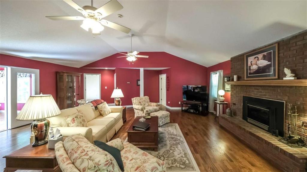 396 Pam Street Wedowee, AL 36278 - Photo 6 of 48 a living room with furniture and a fireplace