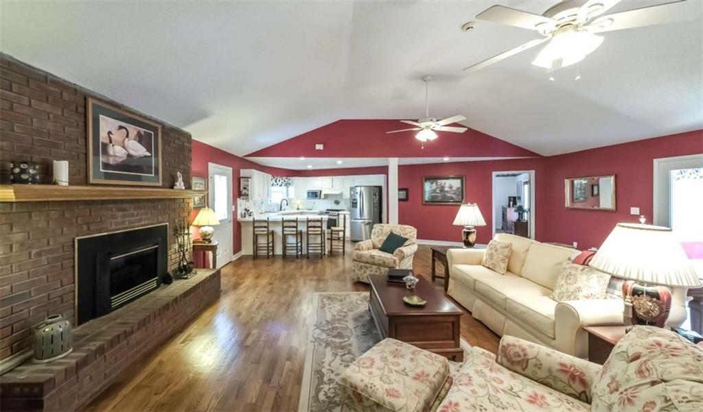 396 Pam Street Wedowee, AL 36278 - Photo 9 of 48 a living room with furniture a fireplace and a flat screen tv