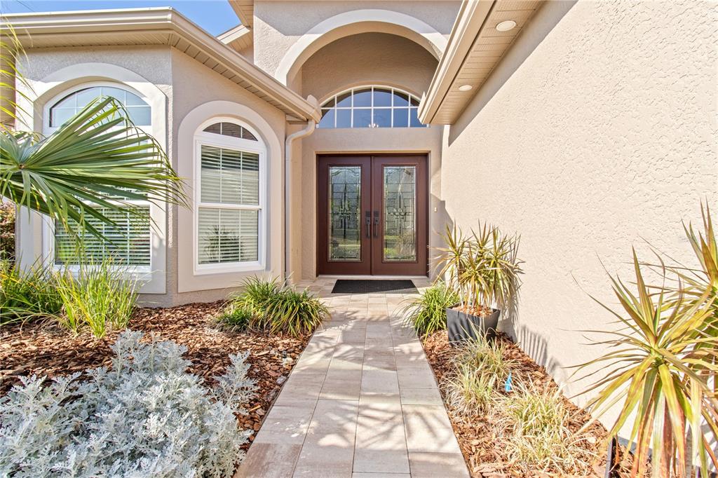 70 Center Oak Circle Spring Hill, FL 34609 - Photo 12 of 58 a front view of a house with garden