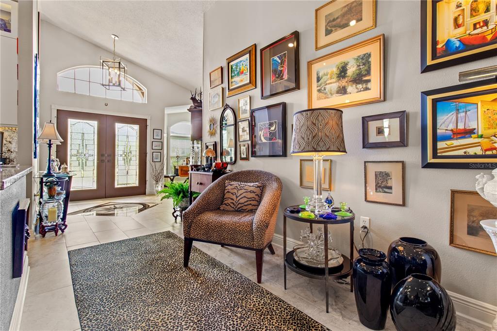 70 Center Oak Circle Spring Hill, FL 34609 - Photo 15 of 58 a living room with furniture and paintings on the wall