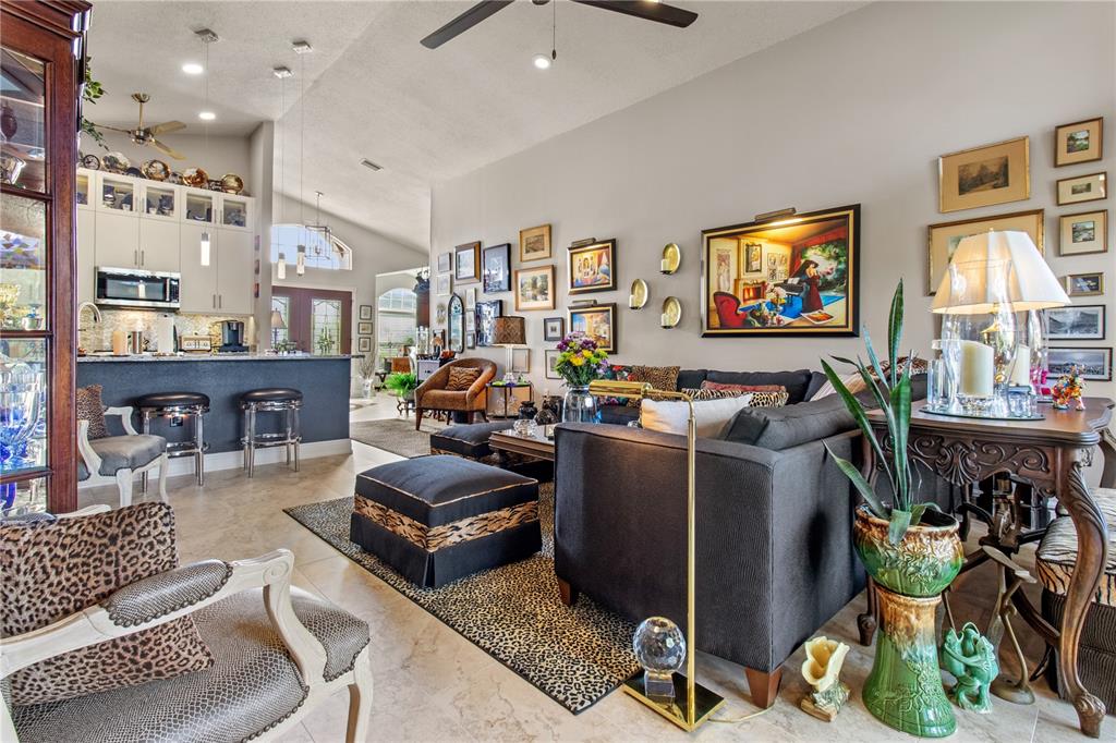 70 Center Oak Circle Spring Hill, FL 34609 - Photo 19 of 58 a living room with furniture and a flat screen tv