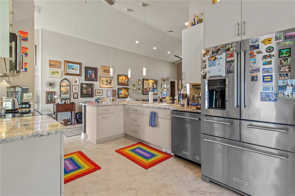 70 Center Oak Circle Spring Hill, FL 34609 - Photo 24 of 58 a kitchen with stainless steel appliances granite countertop a refrigerator and a sink