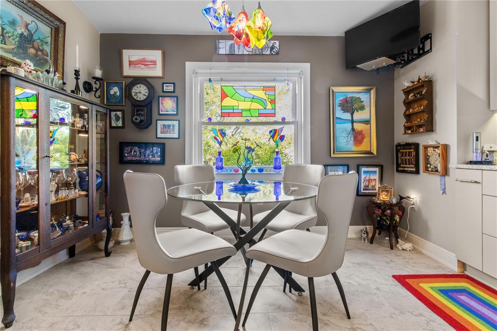 70 Center Oak Circle Spring Hill, FL 34609 - Photo 26 of 58 a view of a dining room with furniture and a chandelier
